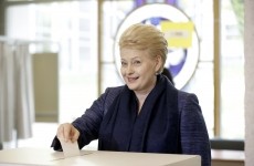 Lithuanian President and independent presidential candidate Dalia Grybauskaite casts her vote during the first round of the country's presidential election in Vilnius