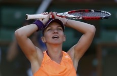 Simona Halep of Romania reacts after winning her women's semi-final match against Andrea Petkovic of Germany at the French Open tennis tournament at the Roland Garros stadium in Paris